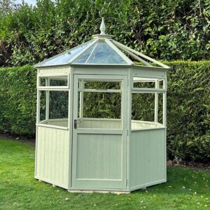 Painted shed with decorative touches and planters